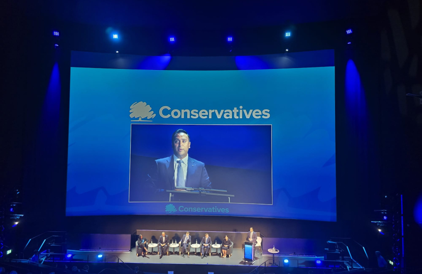 The Conservative Party Leadership contenders on a large stage.