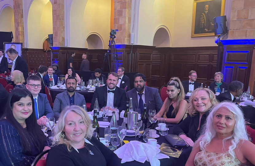 A group photo of guests at their table